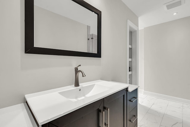 2720 Oak Manor Dr, Mount Pleasant, SC 29466 - bathroom featuring marble finish floors, vanity, and baseboards