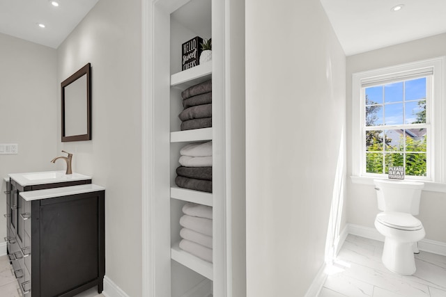 2720 Oak Manor Dr, Mount Pleasant, SC 29466 - bathroom with marble look tiles, vanity, recessed lighting, baseboards, and toilet