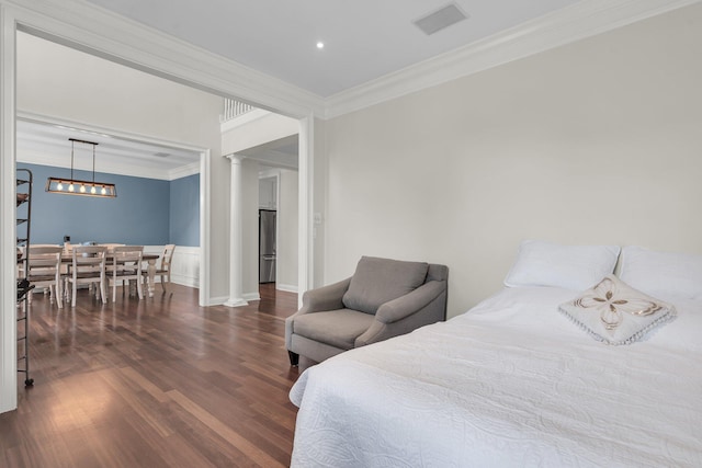 2720 Oak Manor Dr, Mount Pleasant, SC 29466 - bedroom with crown molding, wood finished floors, decorative columns, and a wainscoted wall