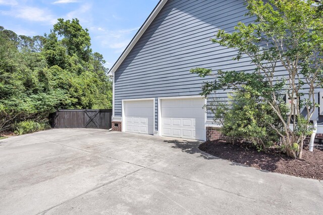2720 Oak Manor Dr, Mount Pleasant, SC 29466 - view of home's exterior with brick siding and concrete driveway