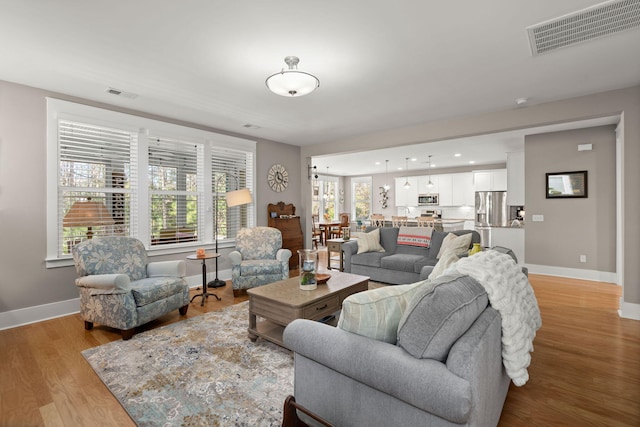 living room featuring light wood-type flooring