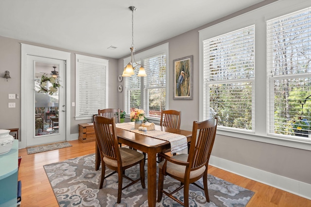 dining space featuring light wood-type flooring