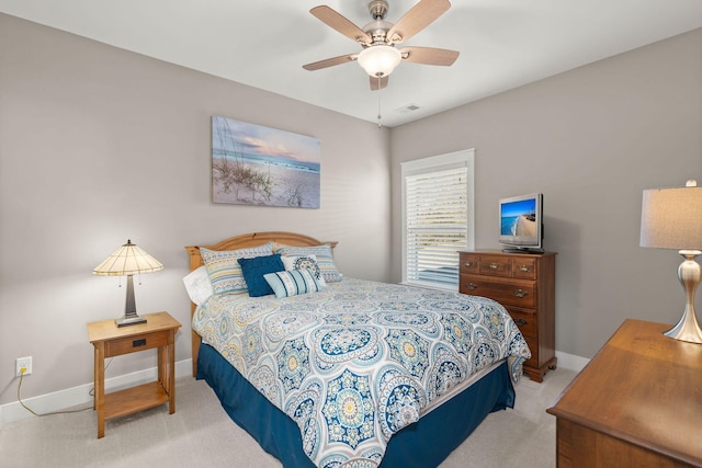 bedroom with light colored carpet and ceiling fan