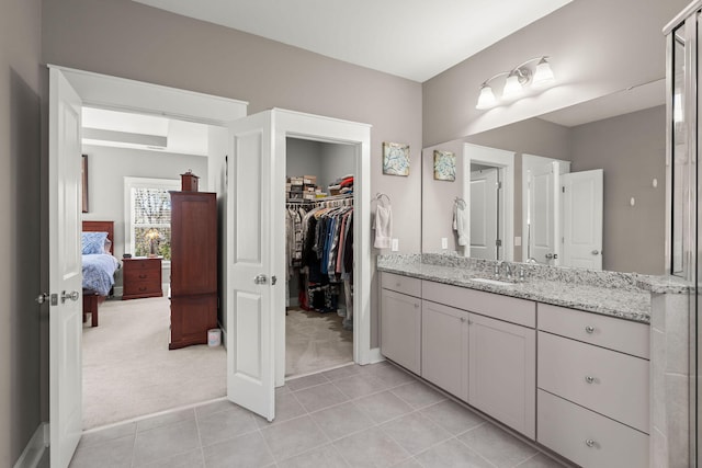 bathroom featuring tile patterned floors and vanity