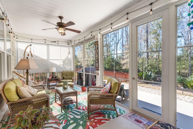 sunroom / solarium with ceiling fan