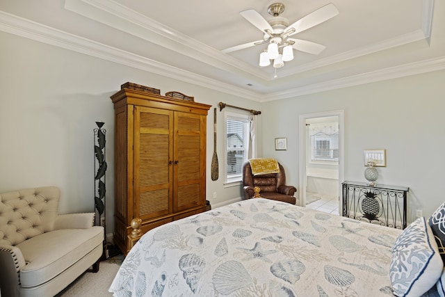 bedroom featuring a raised ceiling and ceiling fan