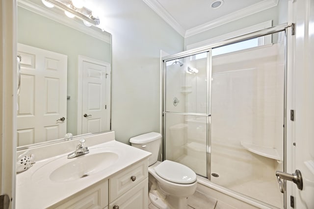 bathroom featuring vanity, crown molding, a shower with door, and toilet