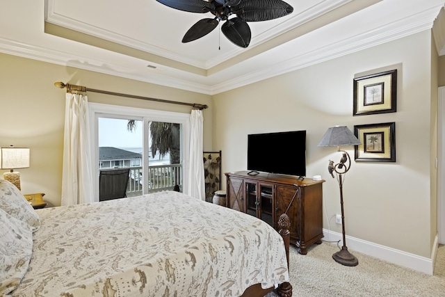 bedroom with light carpet, crown molding, access to outside, and a raised ceiling