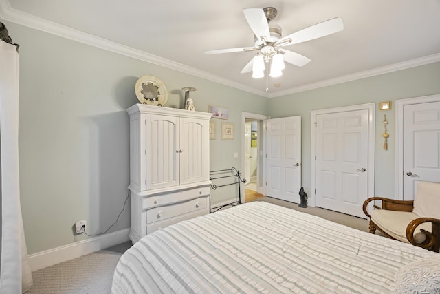 carpeted bedroom featuring crown molding and ceiling fan