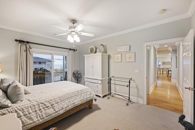 carpeted bedroom with crown molding, access to outside, and ceiling fan