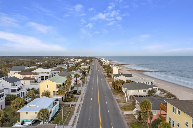 bird's eye view with a water view and a view of the beach