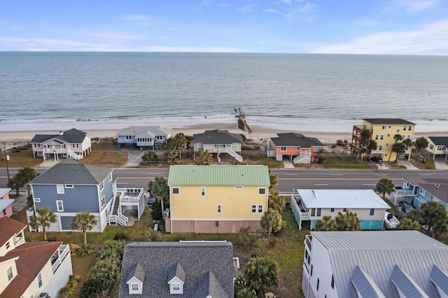 aerial view featuring a view of the beach and a water view