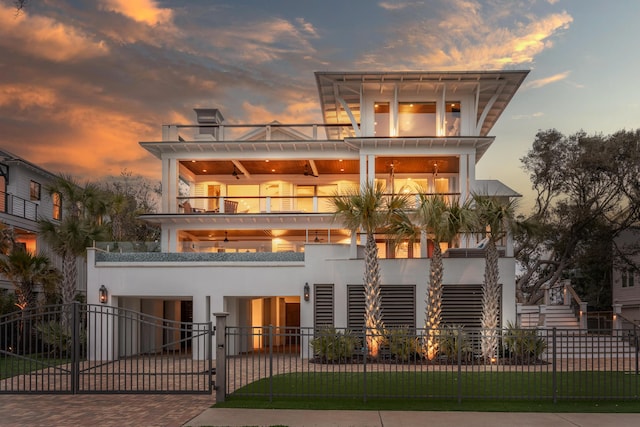 3803 Palm Blvd, Isle Of Palms, SC 29451 - view of front of house with a balcony, a fenced front yard, and a gate