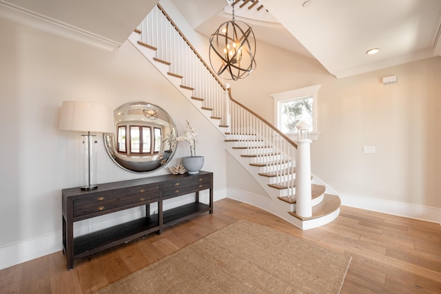 3803 Palm Blvd, Isle Of Palms, SC 29451 - stairway featuring baseboards, wood finished floors, a chandelier, crown molding, and recessed lighting
