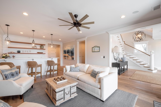 3803 Palm Blvd, Isle Of Palms, SC 29451 - living area featuring dark wood-style flooring, ornamental molding, recessed lighting, stairs, and ceiling fan