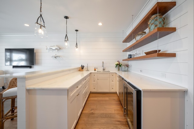 3803 Palm Blvd, Isle Of Palms, SC 29451 - indoor wet bar with beverage cooler, light wood-type flooring, decorative light fixtures, and recessed lighting