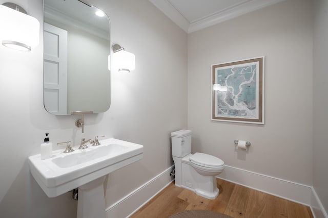3803 Palm Blvd, Isle Of Palms, SC 29451 - half bath featuring ornamental molding, wood finished floors, toilet, and baseboards