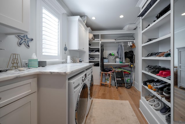 3803 Palm Blvd, Isle Of Palms, SC 29451 - laundry area with cabinet space, washing machine and clothes dryer, light wood-type flooring, and recessed lighting