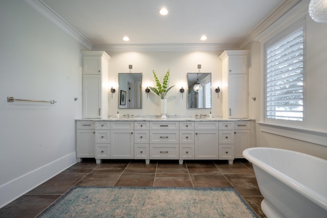 3803 Palm Blvd, Isle Of Palms, SC 29451 - bathroom with double vanity, a freestanding tub, ornamental molding, recessed lighting, and baseboards
