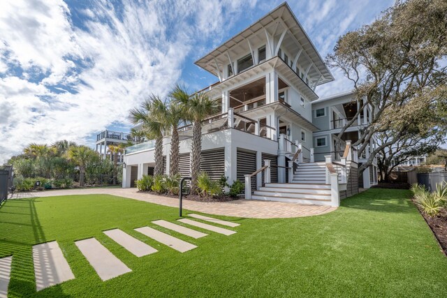 3803 Palm Blvd, Isle Of Palms, SC 29451 - view of front of property featuring stairs, a garage, and driveway