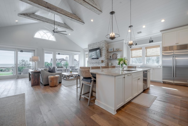 3803 Palm Blvd, Isle Of Palms, SC 29451 - kitchen with appliances with stainless steel finishes, open floor plan, hardwood / wood-style flooring, beamed ceiling, and a sink