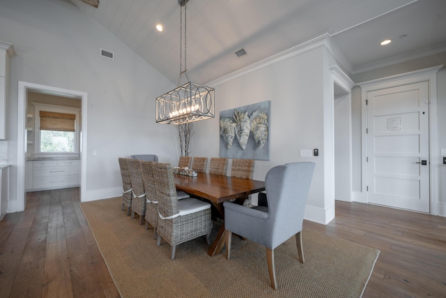 3803 Palm Blvd, Isle Of Palms, SC 29451 - dining area with hardwood / wood-style flooring, baseboards, a chandelier, recessed lighting, and lofted ceiling