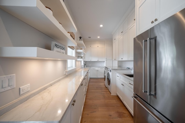 3803 Palm Blvd, Isle Of Palms, SC 29451 - kitchen featuring high end refrigerator, open shelves, light wood-style flooring, white cabinets, and recessed lighting