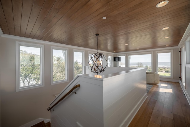 3803 Palm Blvd, Isle Of Palms, SC 29451 - staircase with wooden ceiling, recessed lighting, baseboards, hardwood / wood-style flooring, and a chandelier