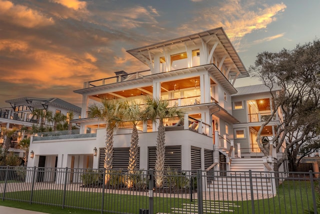 3803 Palm Blvd, Isle Of Palms, SC 29451 - back of property at dusk with a balcony and stairway