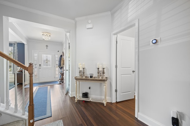 entryway with baseboards, stairway, crown molding, and wood finished floors