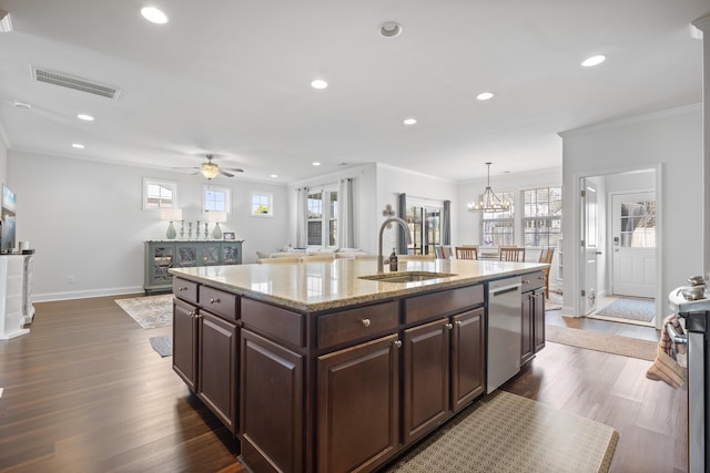 kitchen with stainless steel dishwasher, a sink, visible vents, and a healthy amount of sunlight