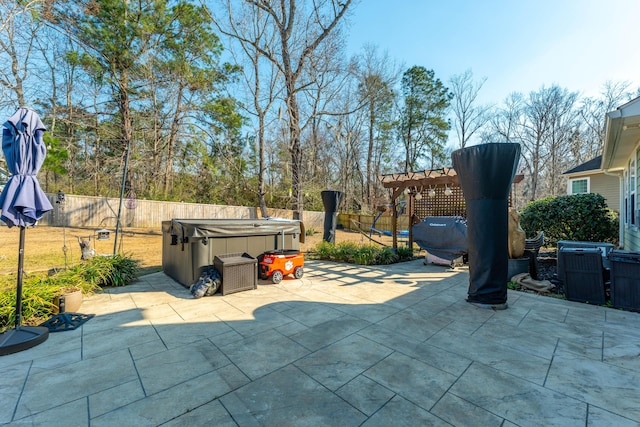 view of patio featuring a hot tub, central AC, a pergola, and a fenced backyard