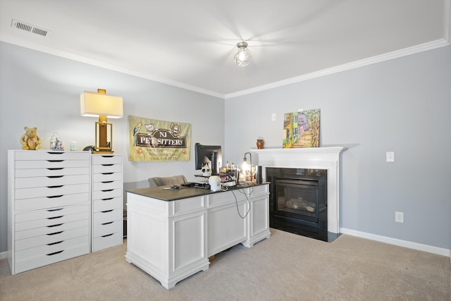 office area with visible vents, baseboards, light colored carpet, a fireplace with flush hearth, and ornamental molding