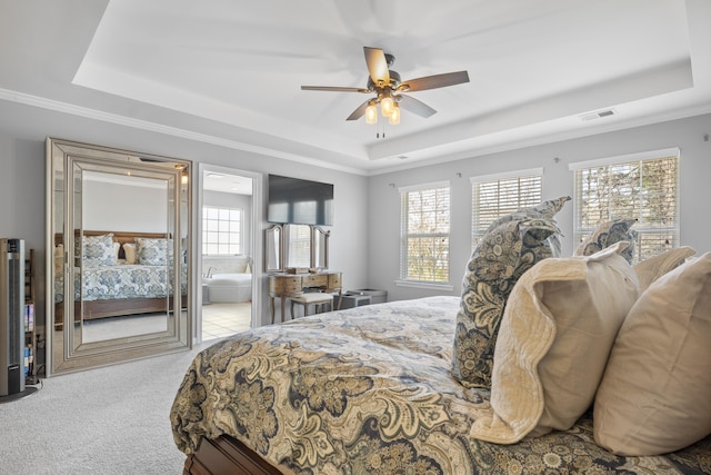 bedroom featuring visible vents, ceiling fan, ornamental molding, carpet, and a tray ceiling