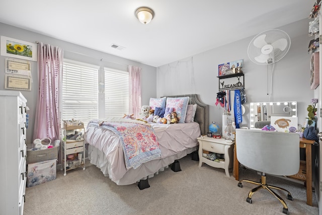 bedroom featuring light carpet and visible vents