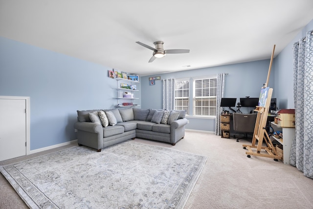 living area with carpet, ceiling fan, and baseboards