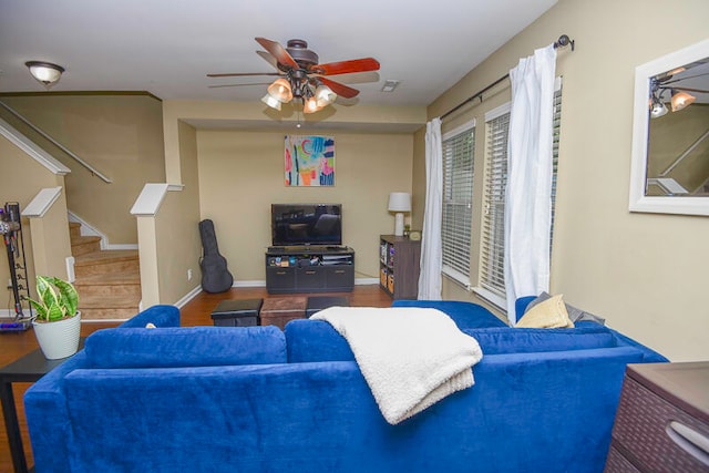 living room with ceiling fan and hardwood / wood-style flooring