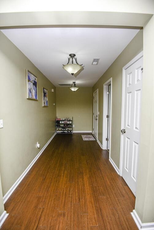 hallway featuring hardwood / wood-style flooring