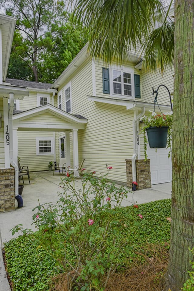 exterior space featuring a porch and a garage