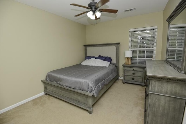 bedroom featuring ceiling fan and light carpet