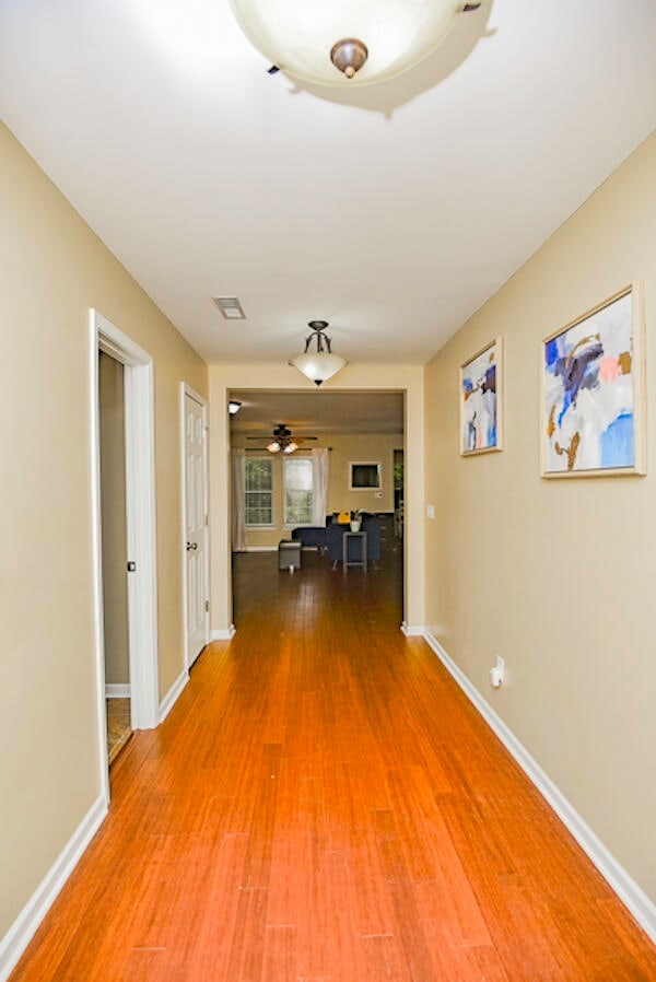 hallway featuring hardwood / wood-style flooring