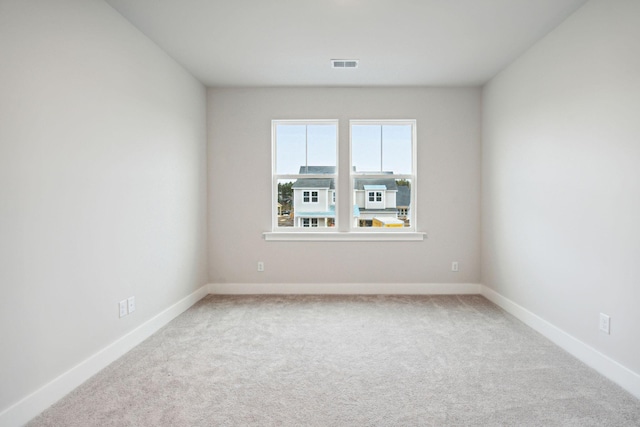 unfurnished room with carpet flooring