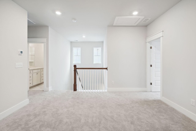 corridor with light colored carpet