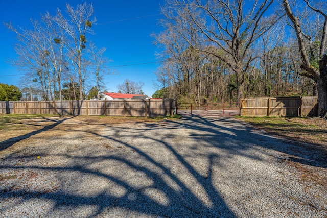 view of road with a gated entry