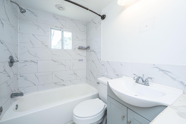 bathroom featuring toilet, shower / washtub combination, vanity, and tile walls