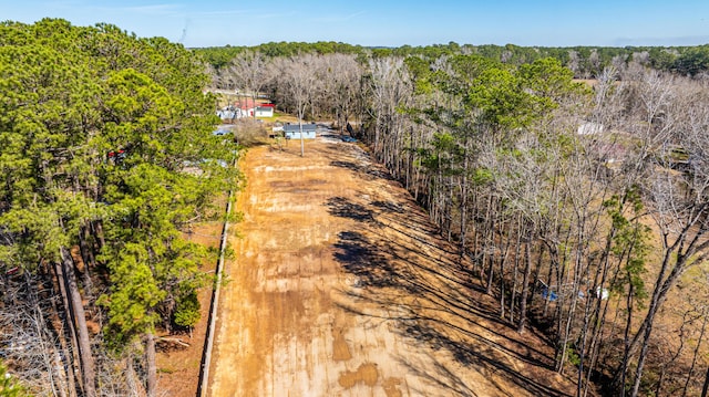 drone / aerial view with a view of trees