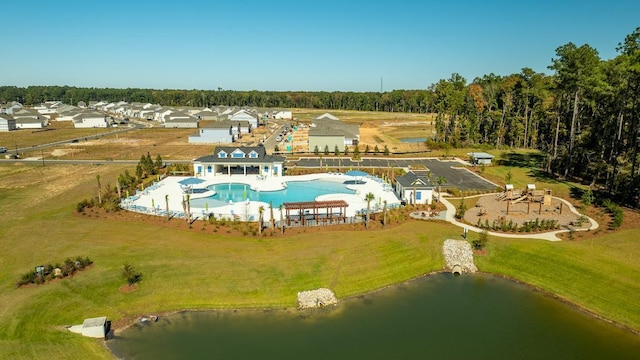 birds eye view of property with a water view