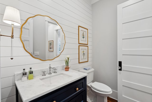 bathroom with toilet and vanity