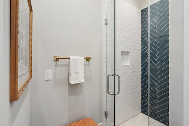 bathroom with a shower stall