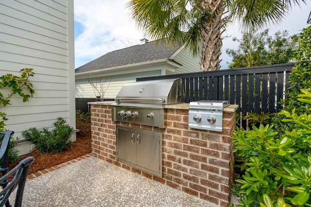 view of patio featuring area for grilling and an outdoor kitchen